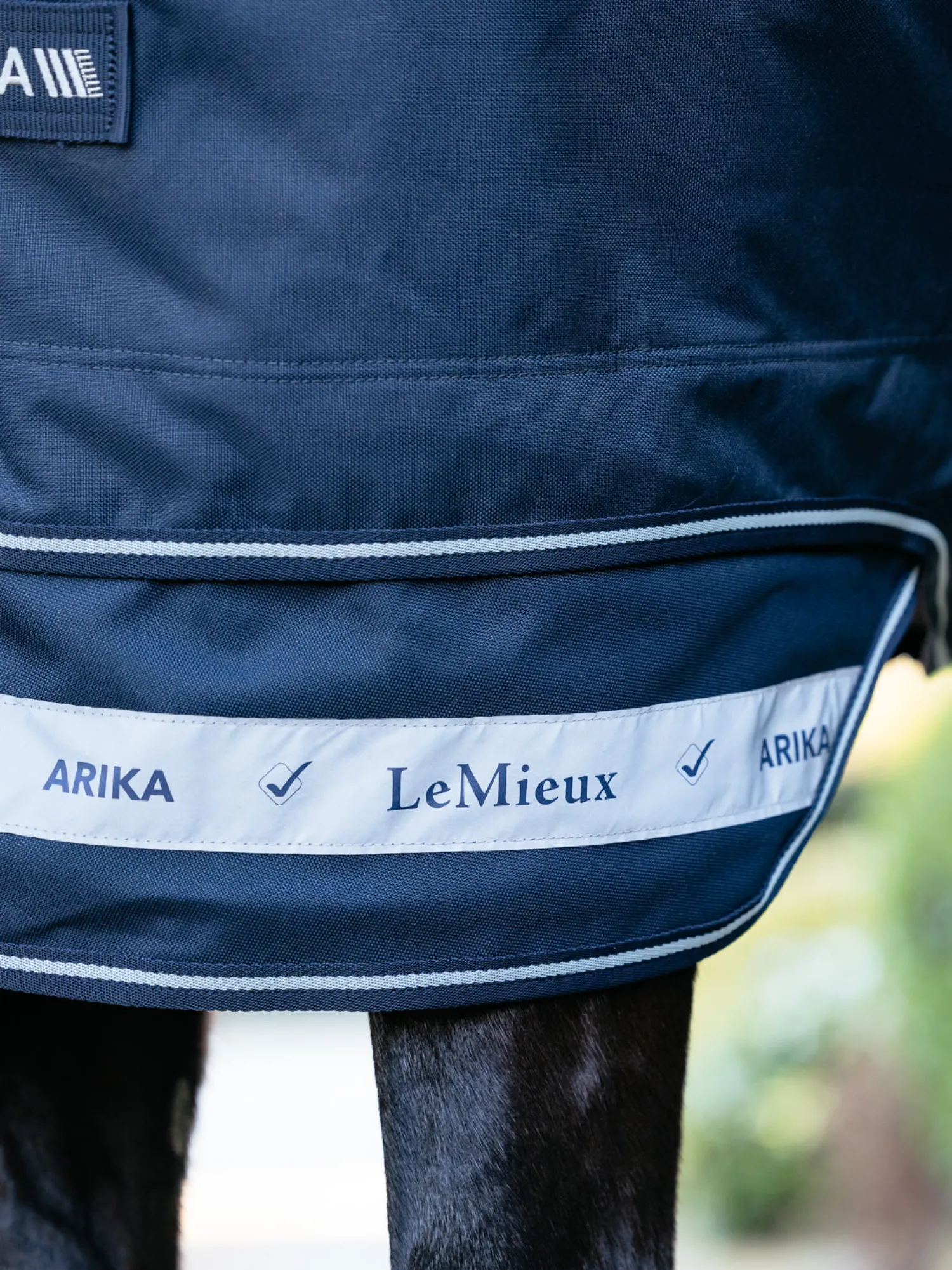 Best HORSE HEALTH TRADE LeMieux® Arika Storm-Tek 100 Gram Turnout Blanket with Leg Straps Navy/White/Navy